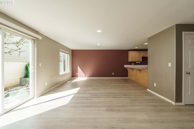 13924 NE 7th Ct, Vancouver, WA 98685 - unfurnished living room with light wood-type flooring, recessed lighting, and baseboards