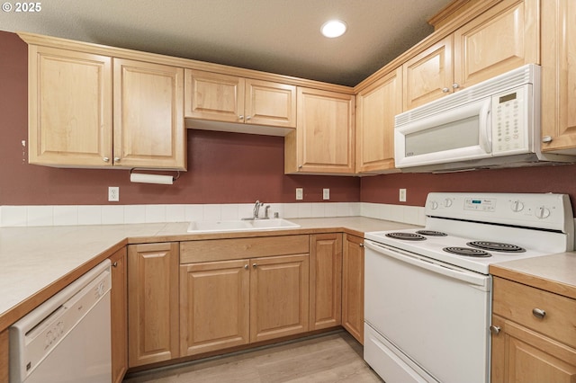 13924 NE 7th Ct, Vancouver, WA 98685 - kitchen featuring white appliances, light brown cabinetry, a sink, light countertops, and recessed lighting