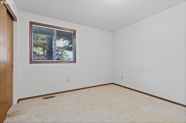 16445 SW Meadowood Way, Portland, OR 97224 - spare room featuring carpet flooring and baseboards