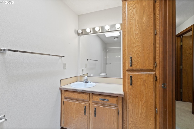 16445 SW Meadowood Way, Portland, OR 97224 - bathroom featuring vanity and a skylight