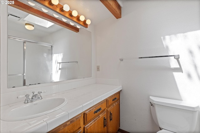 16445 SW Meadowood Way, Portland, OR 97224 - bathroom featuring vanity, beam ceiling, and a shower with door