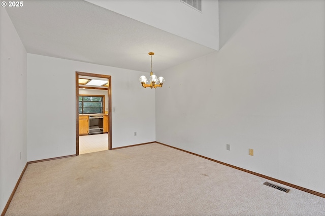 16445 SW Meadowood Way, Portland, OR 97224 - unfurnished room with a chandelier and light colored carpet