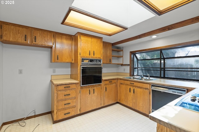 16445 SW Meadowood Way, Portland, OR 97224 - kitchen with black appliances, brown cabinets, light countertops, open shelves, and light floors