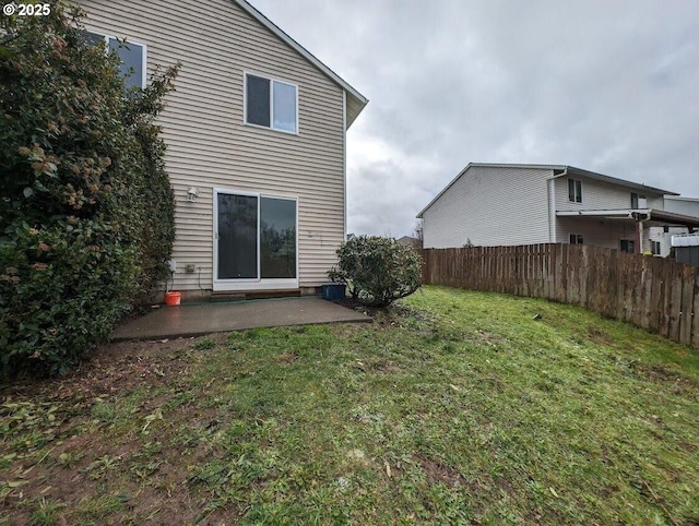 view of yard with fence and a patio