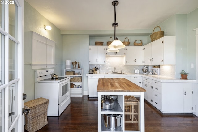 kitchen featuring sink, white appliances, white cabinetry, hanging light fixtures, and tasteful backsplash