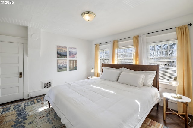 bedroom featuring dark hardwood / wood-style floors