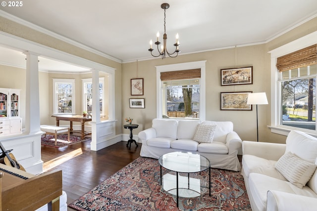 living room featuring decorative columns, a healthy amount of sunlight, and dark wood-type flooring