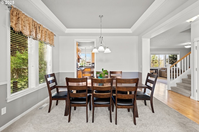 1845 S 15th Ct, Ridgefield, WA 98642 - dining room with stairway, a raised ceiling, baseboards, ornamental molding, and light carpet