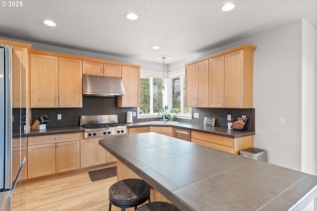 1845 S 15th Ct, Ridgefield, WA 98642 - kitchen with under cabinet range hood, a sink, light brown cabinets, light wood-style flooring, and recessed lighting