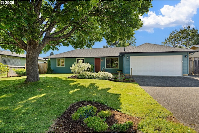 single story home with driveway and a garage