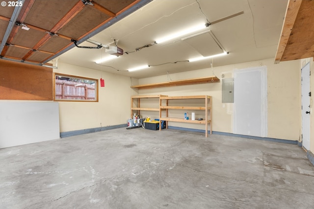 garage featuring a garage door opener and electric panel