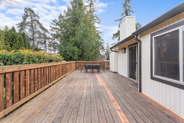 wooden deck featuring outdoor dining space