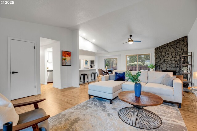 dining room with lofted ceiling, washer / clothes dryer, and light hardwood / wood-style floors