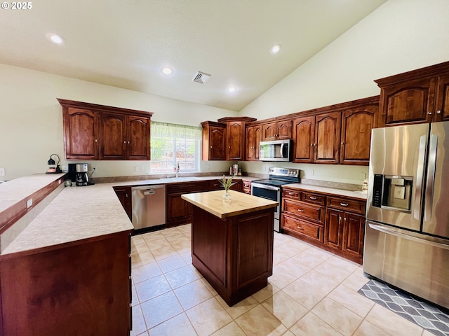 2295 Chi Chi Ln, Sutherlin, OR 97479 - kitchen featuring stainless steel appliances, a sink, recessed lighting, light tile patterned floors, and a center island