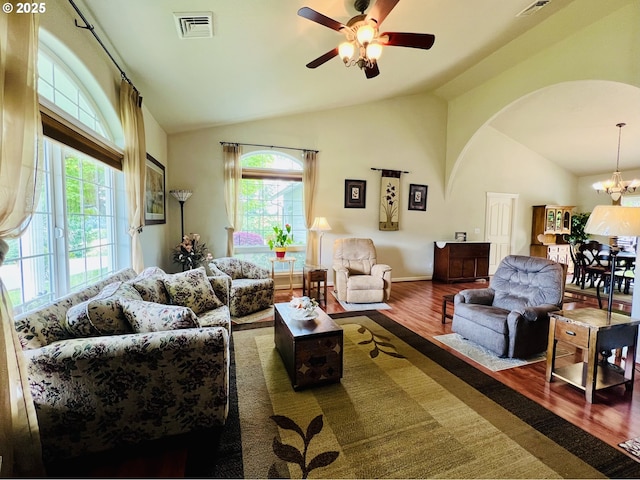 2295 Chi Chi Ln, Sutherlin, OR 97479 - living room with wood finished floors, ceiling fan, high vaulted ceiling, arched walkways, and a chandelier