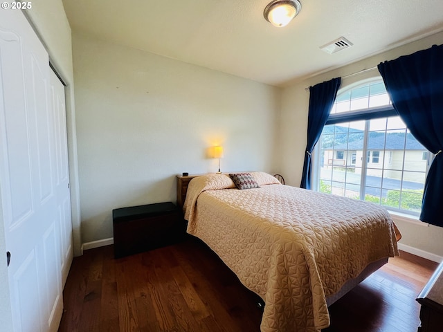 2295 Chi Chi Ln, Sutherlin, OR 97479 - bedroom with hardwood / wood-style flooring, baseboards, and a closet