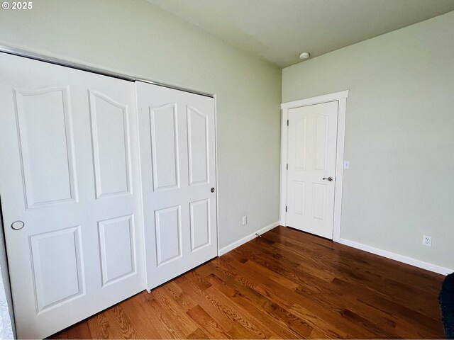 2295 Chi Chi Ln, Sutherlin, OR 97479 - unfurnished bedroom with wood finished floors, baseboards, and a closet