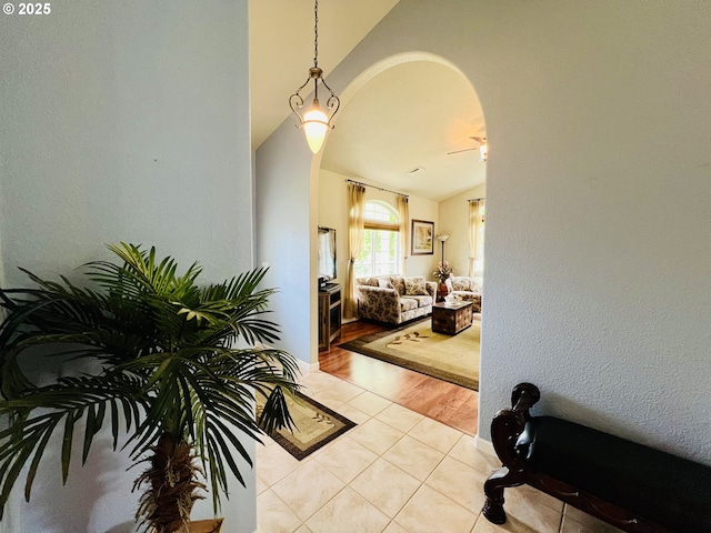 2295 Chi Chi Ln, Sutherlin, OR 97479 - corridor with arched walkways, vaulted ceiling, and light tile patterned floors