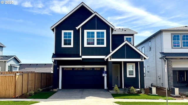 17880 SW Alvord Ln, Beaverton, OR 97007 - craftsman-style home with cooling unit, driveway, fence, a garage, and board and batten siding