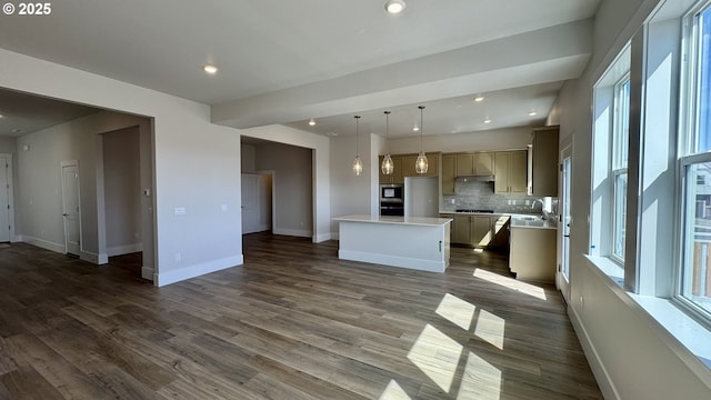 17880 SW Alvord Ln, Beaverton, OR 97007 - unfurnished living room featuring recessed lighting, baseboards, dark wood-style flooring, and a sink