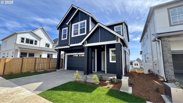 17880 SW Alvord Ln, Beaverton, OR 97007 - view of front of house with fence, driveway, board and batten siding, and a garage