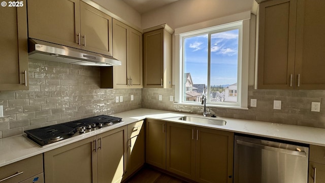 17880 SW Alvord Ln, Beaverton, OR 97007 - kitchen featuring a sink, light countertops, under cabinet range hood, stainless steel appliances, and backsplash