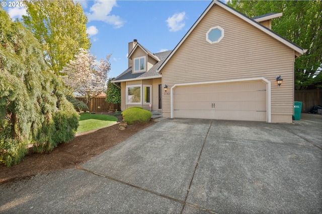 view of front facade with a chimney, roof with shingles, a garage, fence, and concrete driveway