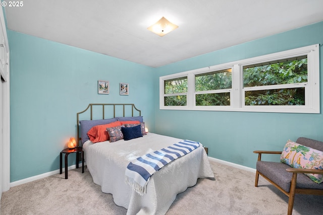 bedroom with light colored carpet