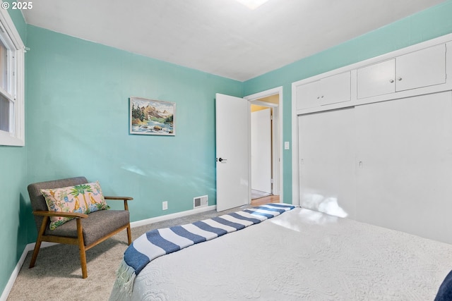 carpeted bedroom featuring a closet