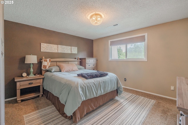 carpeted bedroom featuring visible vents, a textured ceiling, and baseboards