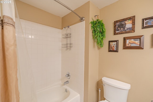 bathroom with shower / bathtub combination with curtain and toilet