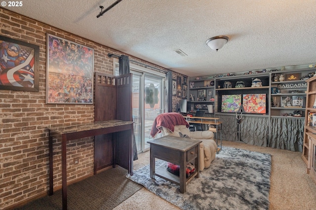 living area with a textured ceiling, visible vents, and carpet