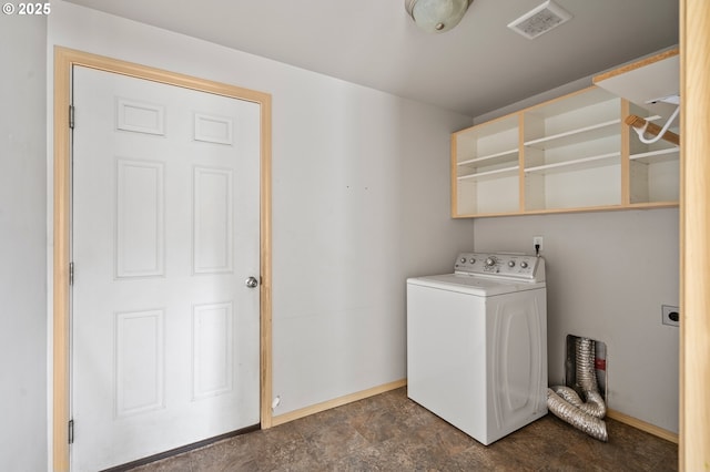 clothes washing area featuring washer / clothes dryer, baseboards, stone finish floor, visible vents, and laundry area