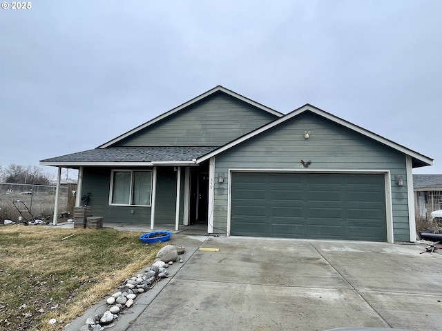 ranch-style home with a front lawn and a garage