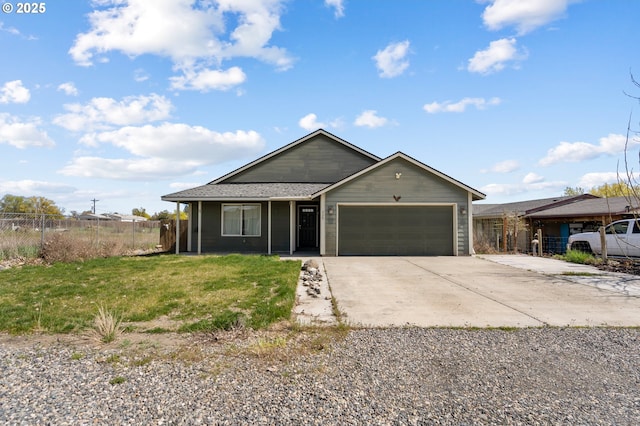 view of front facade featuring a porch, a front yard, fence, a garage, and driveway