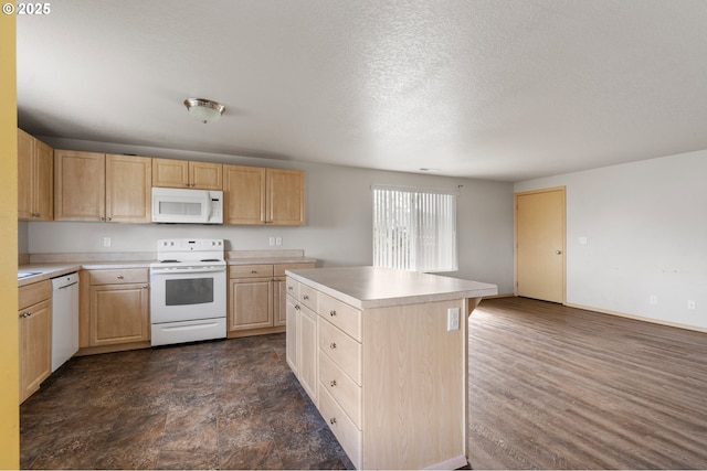 kitchen with light countertops, white appliances, light brown cabinetry, and a kitchen island