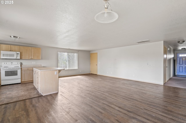 kitchen featuring visible vents, open floor plan, light countertops, white appliances, and light brown cabinetry
