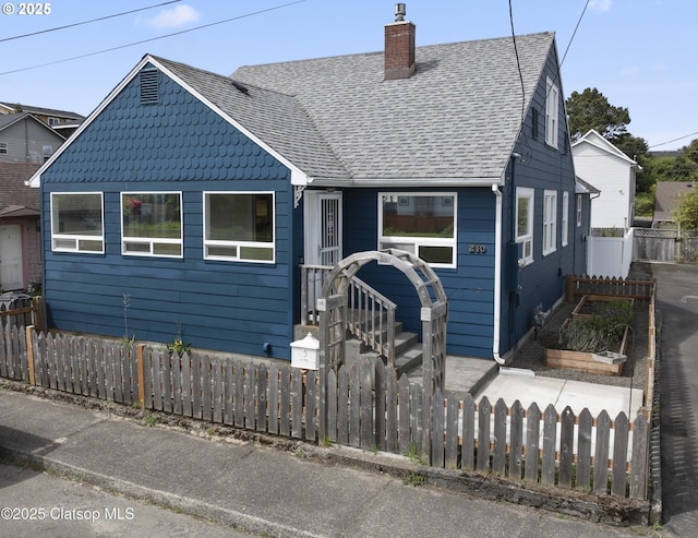 240 5th Ave, Seaside, OR 97138 - bungalow-style house with a chimney, a fenced front yard, and a shingled roof