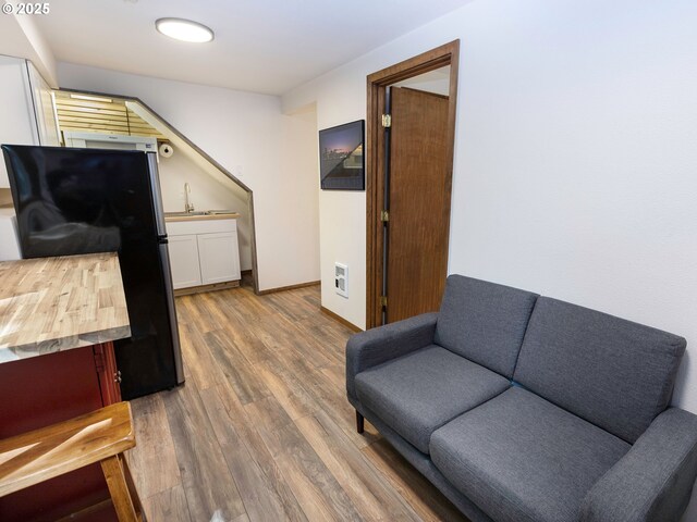 sitting room featuring wood finished floors and baseboards