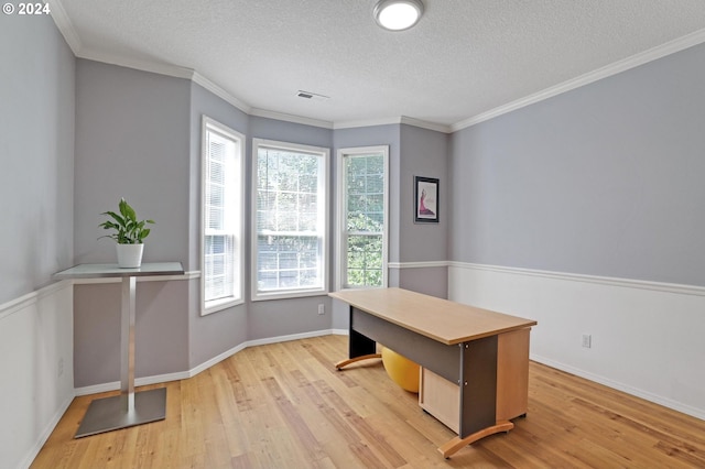 office area featuring crown molding, a textured ceiling, and light hardwood / wood-style floors