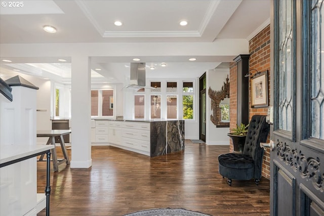 bar with recessed lighting, a tray ceiling, dark wood finished floors, and range hood