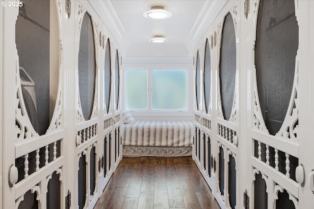 interior space with ornamental molding and dark wood finished floors