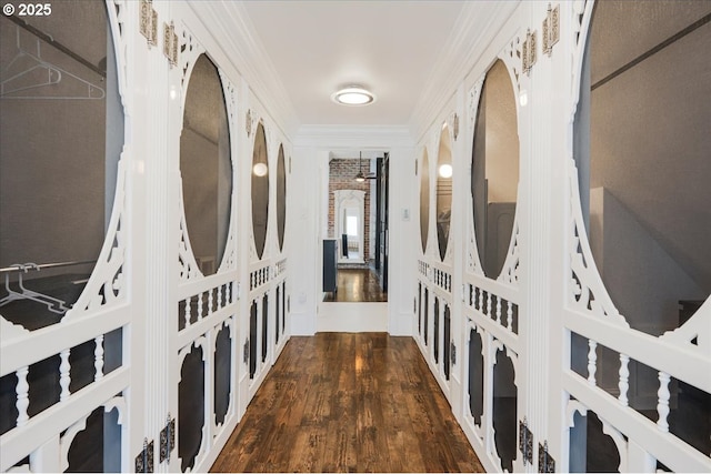 hallway featuring crown molding and wood finished floors