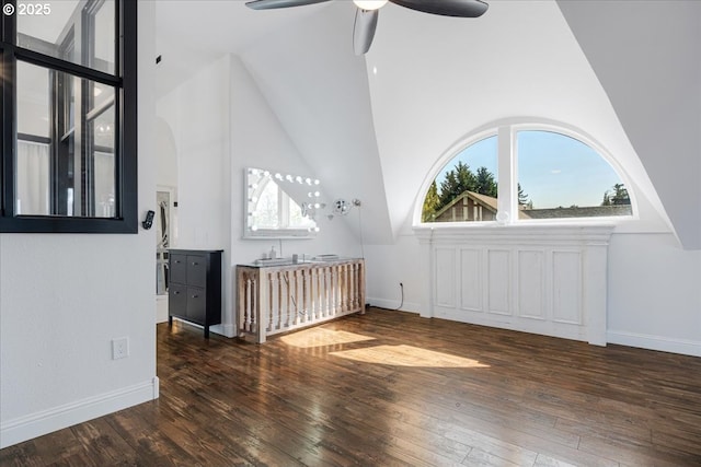 bonus room featuring wood-type flooring, baseboards, ceiling fan, and high vaulted ceiling
