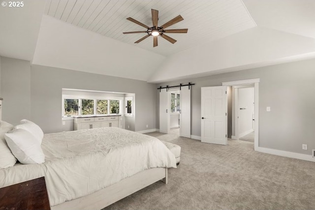 bedroom featuring ceiling fan, a barn door, light carpet, baseboards, and vaulted ceiling