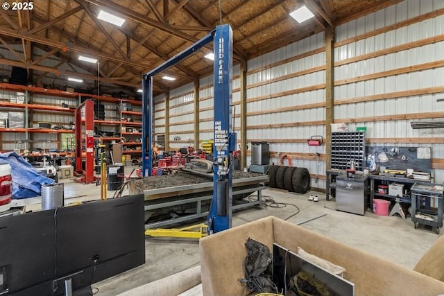 garage featuring metal wall and a workshop area