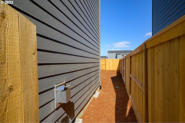 view of side of property with fence private yard