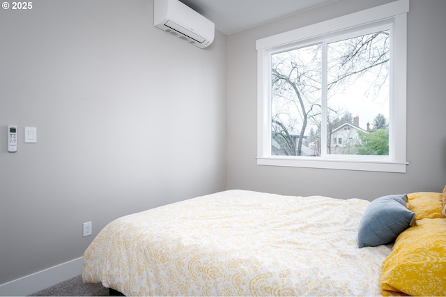 bedroom with an AC wall unit