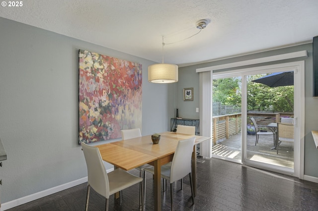 1842 SW Lobelia St, Portland, OR 97219 - dining area featuring dark wood-type flooring and a textured ceiling