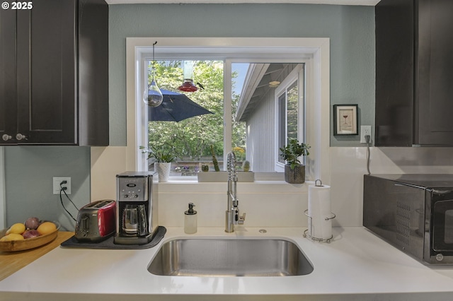 1842 SW Lobelia St, Portland, OR 97219 - kitchen with black microwave and light countertops